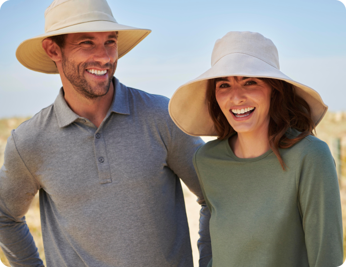 Men and women wearing Solbari sun hats and clothing on the beach.
