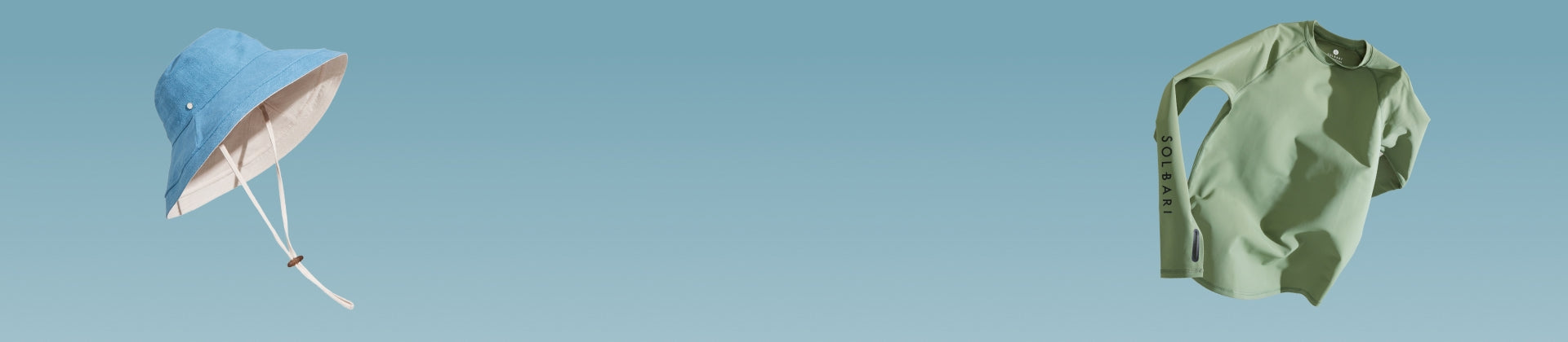A blue sun hat and a light green top floating on a light blue background.
