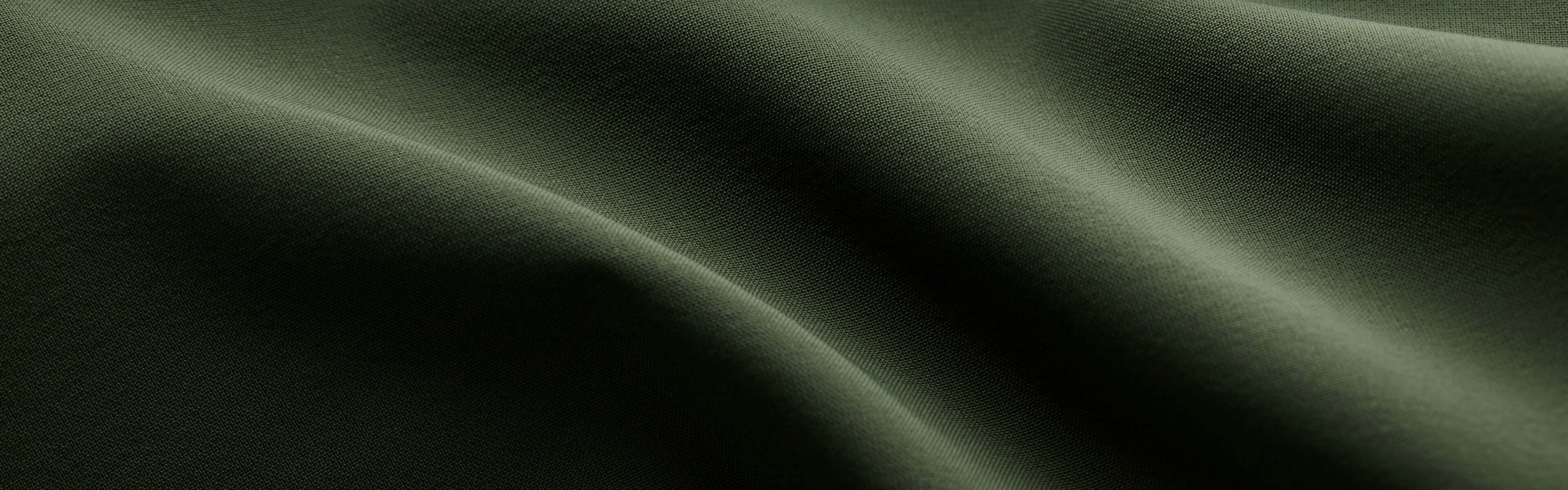Green fabric close-up image.