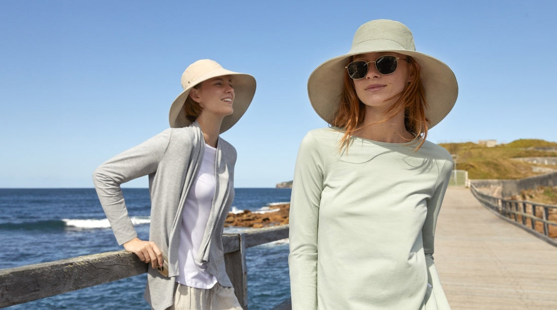 A woman and a man wearing Solbari sun hats.