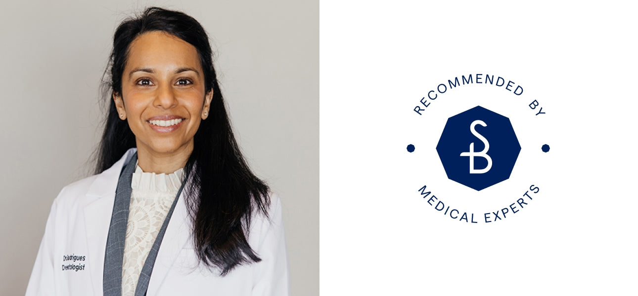 Dr in a white lab coat with a Solbari logo