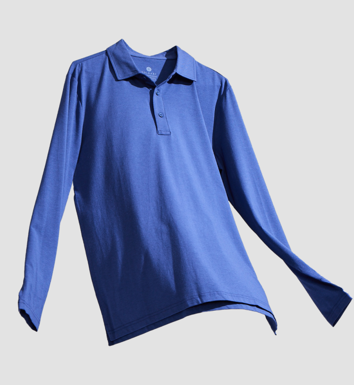 A blue polo shirt with long sleeves on a light blue background.