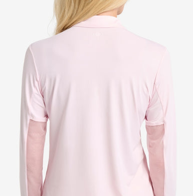 The back view of a pink top on a woman with mesh sleeve insets.
