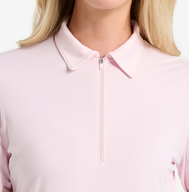 A pink top with a close-up of a zip at the neck.